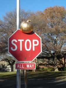 Read more about the article Pumpkin On A Stop Sign